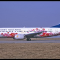 20011421 HainanAirlines B737-400 B-2576 PinkFlowers-colours PEK 02022001